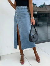 Light-wash midi denim skirt with front button slit closure and high slit for a stylish casual look