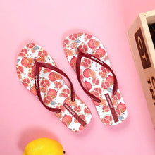 Pair of white fruit print summer toe post slippers with red pomegranate pattern