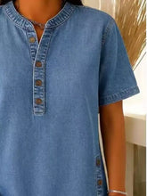 A light blue denim full size button detail short sleeve blouse plus size with button-down front and short sleeves