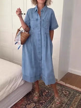 Light blue denim midi dress with short sleeves and full button front closure perfect for machine wash cold care