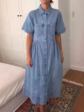 Light blue denim midi dress plus size with short sleeves button front and two chest pockets machine wash cold