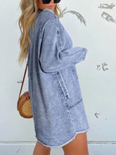 Light-wash denim shirt dress with full size button front frayed hem and cuffs featuring classic patch pockets