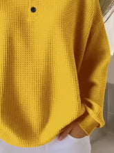 Full size casual yellow waffle knit pullover with button detail made of slightly stretchy material