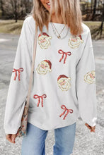 Plus size white corduroy sweatshirt with sequin santa bow patches and red bows featuring care instructions label