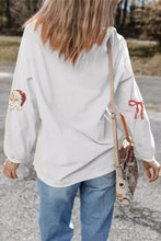 Plus size white corduroy long sleeve top with sequin santa bow embroidered patches and care instructions on sleeves