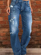 Full size distressed raw hem jeans plus size featuring blue denim with intentional rips and frayed edges