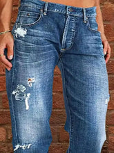 Full size distressed raw hem jeans in blue denim with distressed patches and white crab embroidery on the thigh