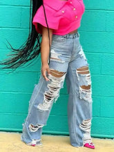 Full size distressed wide-leg jeans plus size in light blue denim with extensive ripped detailing along the legs