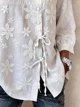 White embroidered floral blouse with lace-up front detail featuring floral embroidered button design plus size full size