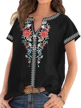 Black plus size floral notched short sleeve blouse featuring vibrant red pink and blue embroidery on neckline and sleeves