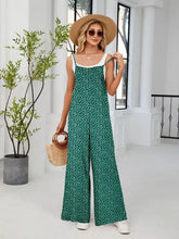 Green floral print wide leg jumpsuit in plus size with white straps