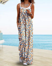 Woman in full size floral print wide leg jumpsuit with orange blue flowers