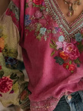 A vibrant pink velvet full size floral v neck blouse plus size with intricate red blue and green floral embroidery