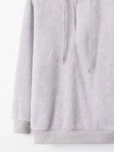 Light gray plush terry cloth fleece hoodie with half zip front zipper and matching drawstring for full sleeve length