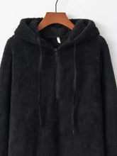 Black fleece hoodie with half zip front, fuzzy material, matching drawstrings, and long sleeve length in plus size