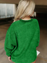 Woman in full size Howdy graphic round neck sweatshirt with long sleeves