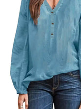 Full size notched light blue long sleeve blouse with v neck and button closure in plus size design
