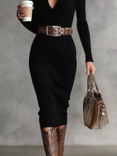 Black ribbed knit midi dress with deep V-neck and long sleeves