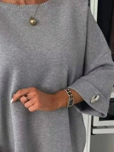 Full size round neck drop shoulder plus size top in soft heather gray with ribbed trim and buttoned cuffs machine wash cold