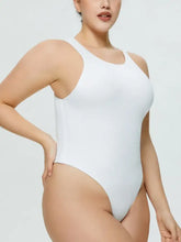 White one-piece swimsuit with sleek form-fitting design and thin shoulder straps featuring size round neck wide style