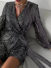 Shimmering black sequin surplice tie waist long sleeve romper, machine wash