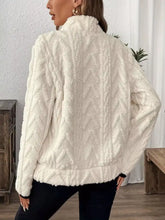 Cream-colored plush sherpa half zip sweatshirt with cable-knit pattern and high collar machine wash cold safe