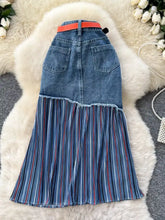 Full size striped patchwork denim skirt with blue and red pleated lower section and orange belt plus size
