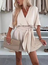 Beige surplice tie waist romper in plus size with flutter sleeves