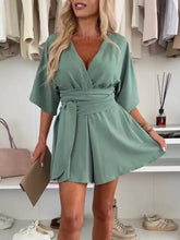 Sage green surplice tie waist romper in plus size with v-neck and belt