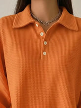 Orange waffle knit polo shirt with white buttons and collar in plus size full size waffle knit machine wash product