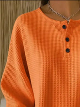 Bright orange waffle knit full size henley top with black buttons machine wash cold for plus size wear