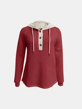 Red waffle knit hoodie with cream contrast long sleeve placket