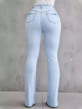 Light blue high-waisted flare jeans with subtle stitching in size wash denim for plus size wear