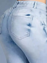 Light-wash full size wash high-waisted flare jeans with faded distressed look and visible stitching details in plus size
