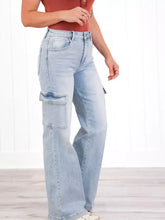 Light-wash denim cargo jeans with a high-rise fit and wide-leg cut for plus size in size wash wide leg style
