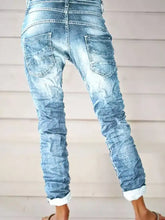 Full size washed button-fly jeans in light-wash denim with relaxed ruched fit and rolled cuffs for plus size wear