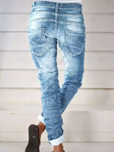 Full size washed button-fly jeans plus size in light-wash denim with rolled cuffs and a distressed faded look