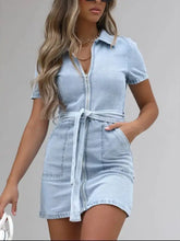Light blue short sleeve denim dress with collar front zipper and tied waistband in plus size design