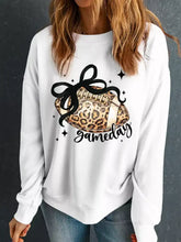White long-sleeved crew neck sweatshirt with leopard rugby graphic and gameday script for casual wear