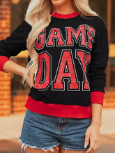 Black and red game day baggy sweatshirt with glittery varsity striped detail, slightly stretchy and machine wash cold