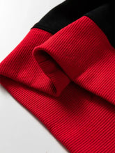 Red slightly stretchy ribbed knit sleeve with black cuff on game day baggy sweatshirt machine wash cold safe