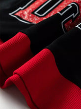 Game day slightly stretchy baggy sweatshirt with red and black ribbed knit sleeve and bold white outlined 10 graphic designed for machine wash cold