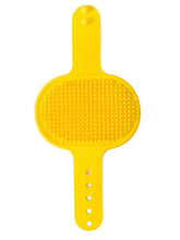 Spazzola delicata in silicone per rimuovere i peli degli animali con retro e superficie gialla a pois