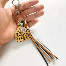 Genuine leather key chain with turquoise fringe and sunflower charm