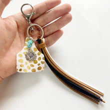 Genuine leather key chain with turquoise fringe and sunflower charm