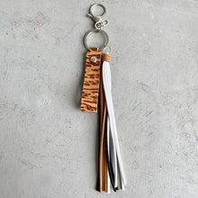 Genuine leather tassel keychain with embossed strap and multi-color tassels