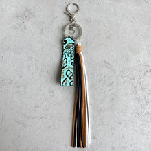 Genuine leather tassel keychain with turquoise embossed strap and multi-color tassels