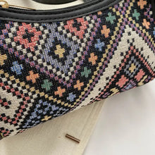 Boho printed crossbody bag with geometric patterns and black trim