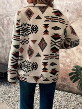 Cream-colored fleece geometric half zip long sleeve sweatshirt with black and rust-brown pattern machine wash cold