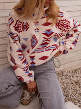 Cream-colored fleece sweatshirt with red and blue geometric tribal patterns machine wash cold recommended